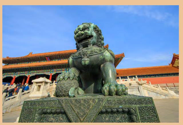 The bronze male lion in front of the Gate of Supreme Harmony