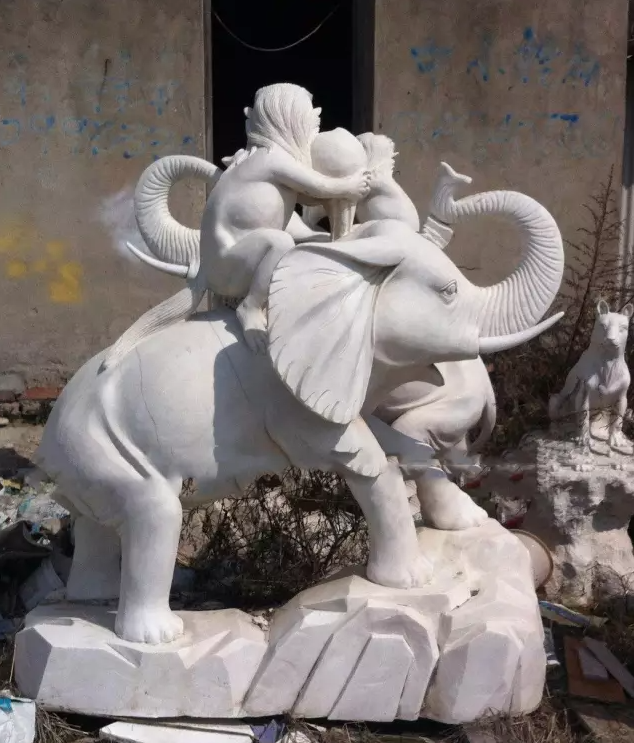 Elephant sculpture with monkey sitting on its back