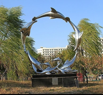 sculptures of dolphins