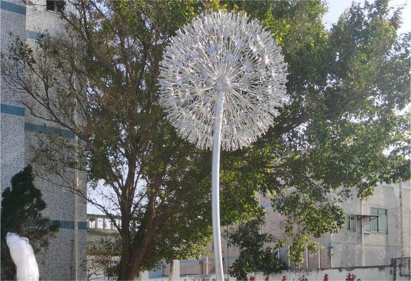 What is the symbolic meaning of the dandelion sculpture? Garden metal dandelion art sculpture for sale