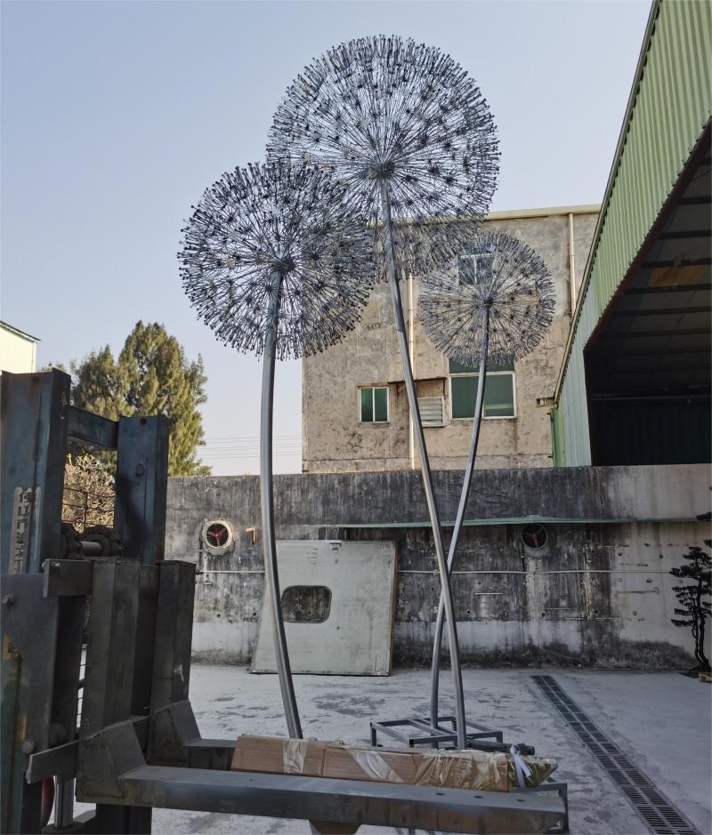 What is the symbolic meaning of the dandelion sculpture? Garden metal dandelion art sculpture for sale