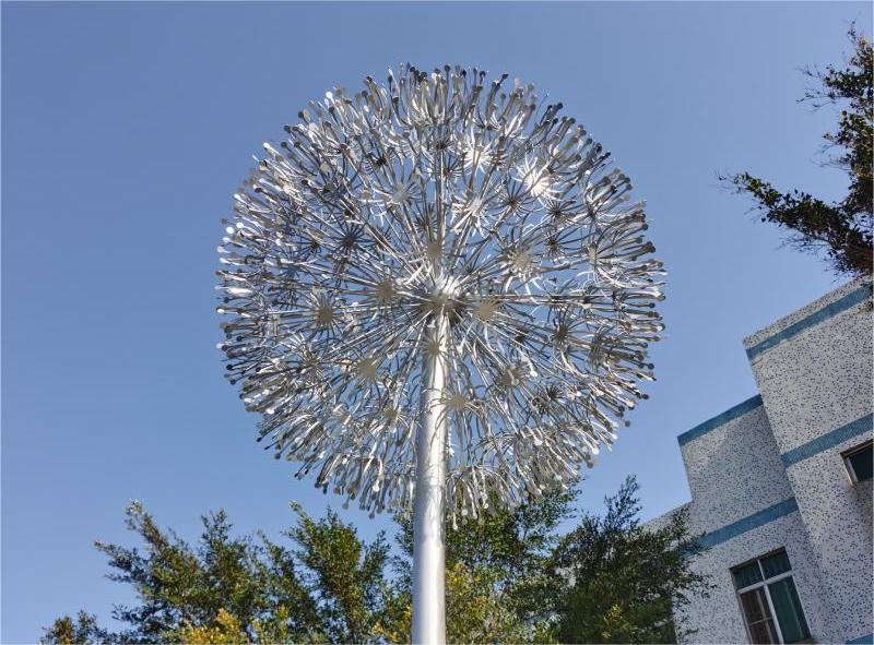 What is the symbolic meaning of the dandelion sculpture? Garden metal dandelion art sculpture for sale