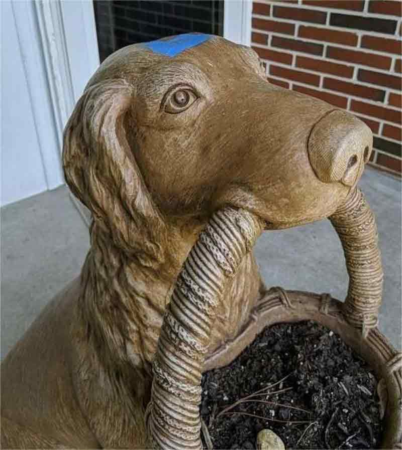 Life size bronze dog with basket garden statue for front porch