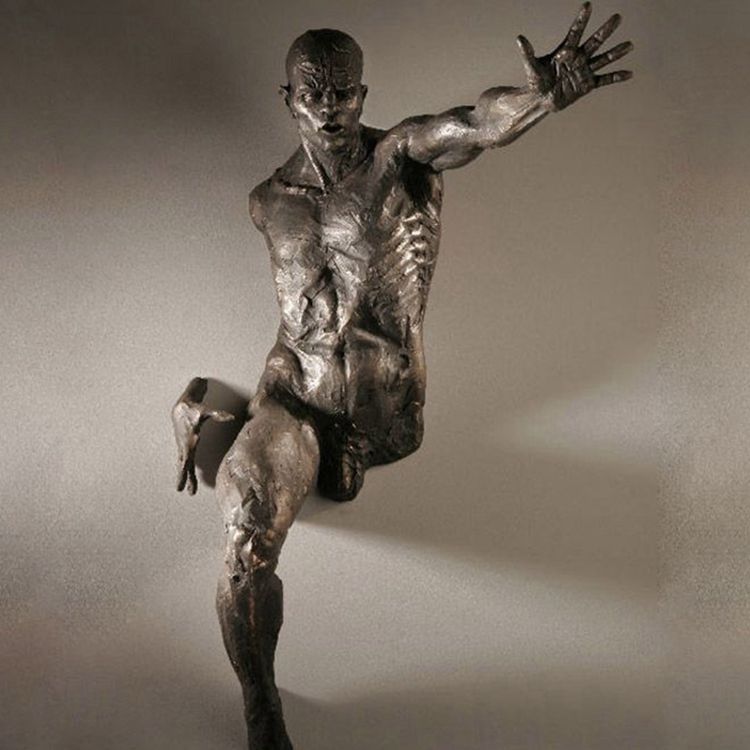 Bronze nude body statue by Matteo Pugliese through wall