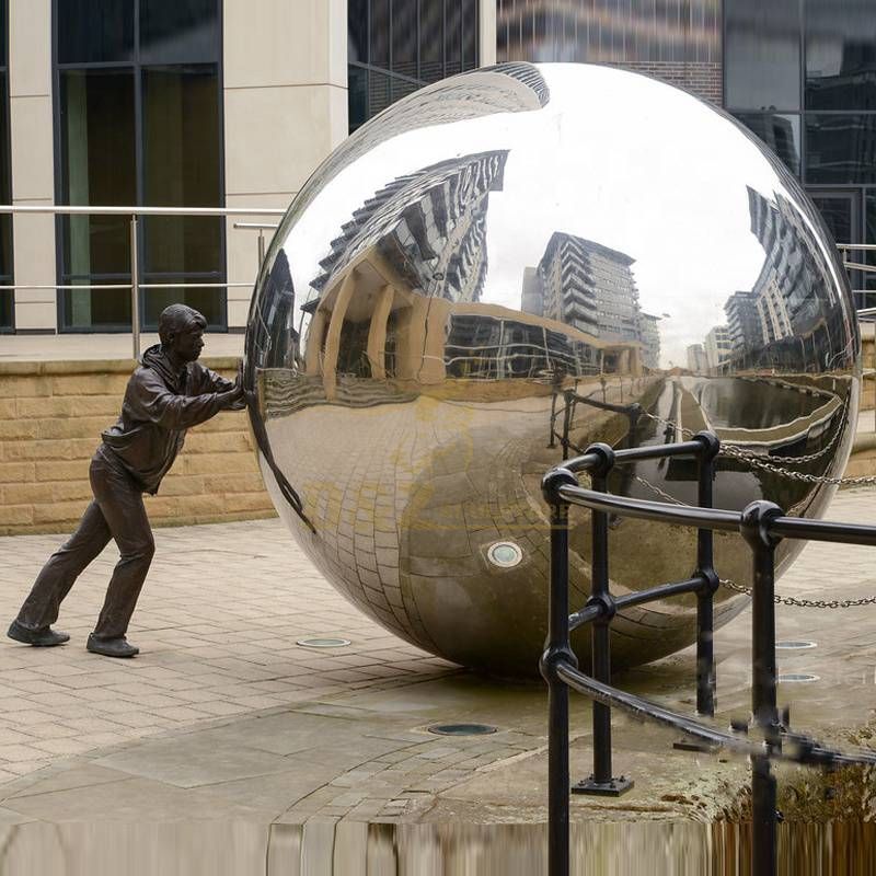 Bronze figure with stainless steel Ball Sculpture