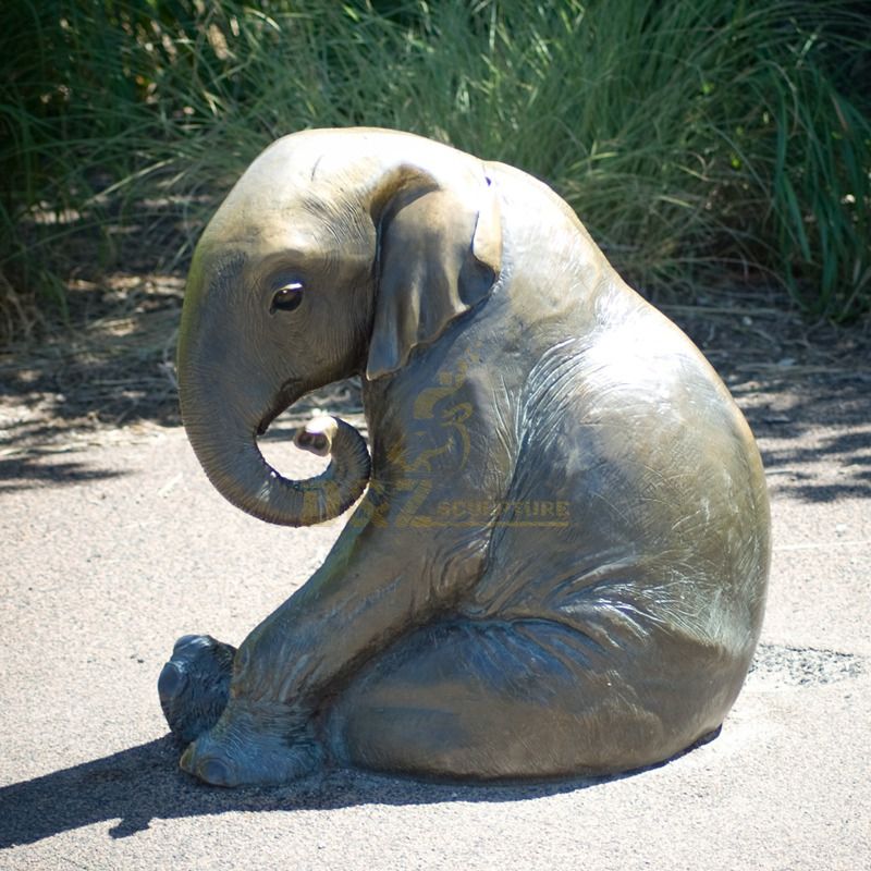 Outdoor grass sitting bronze elephant sculpture
