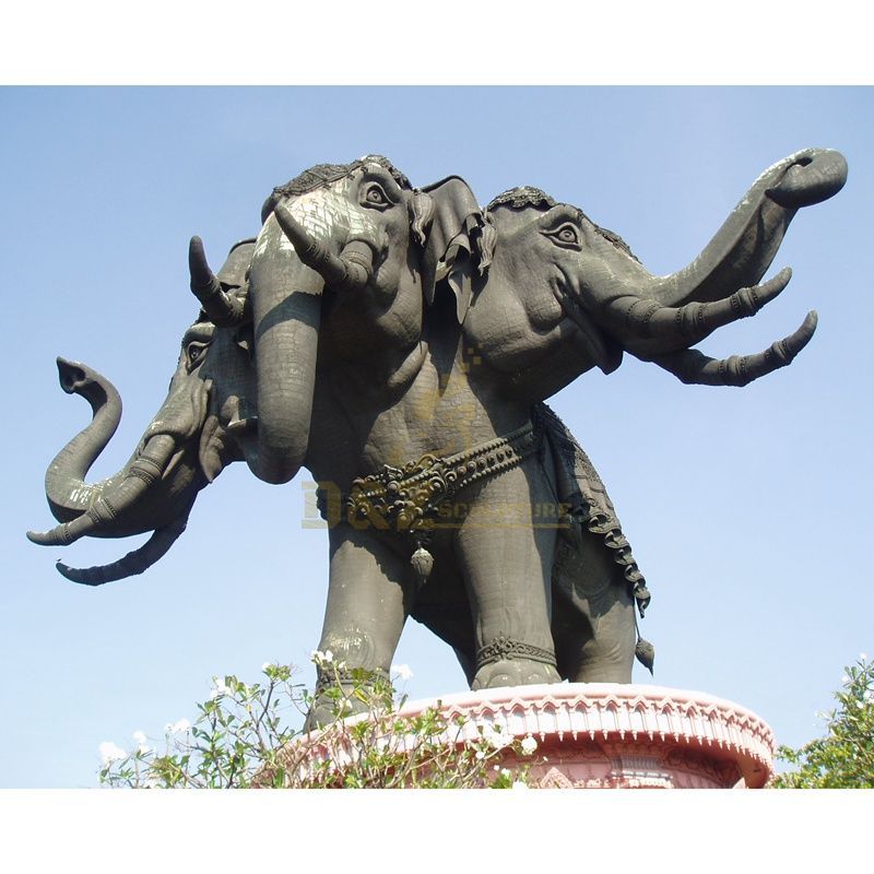 Large outdoor bronze sculpture of three head elephants in modern temple