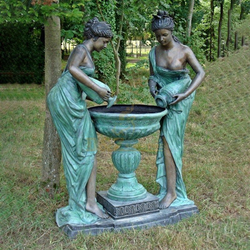 Bronze boy and girl statue water fountain