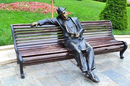 The streets decoration bronze statue sitting man on bench sculpture