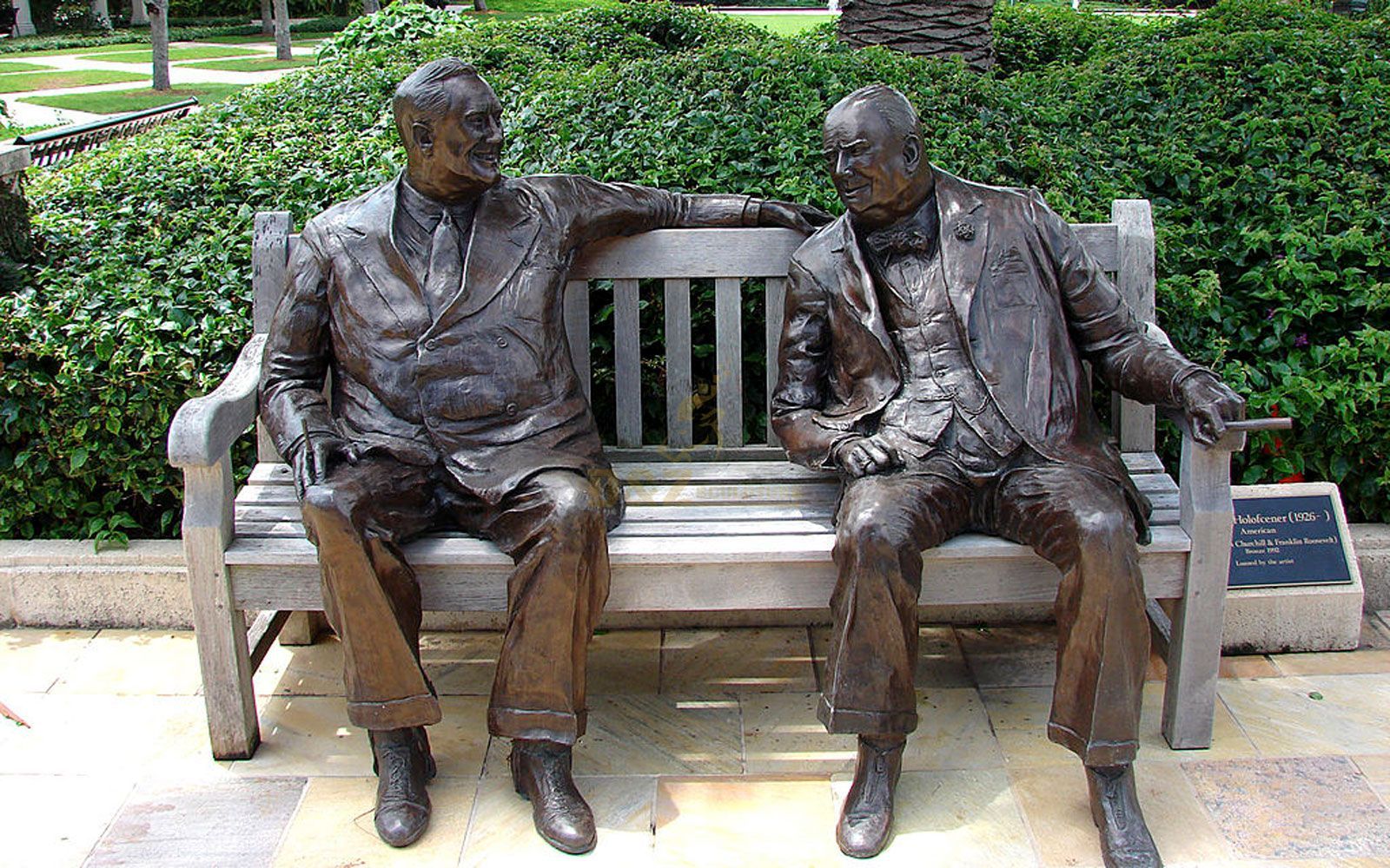 Life size city bronze statues two man siiting on the chair talking with each other
