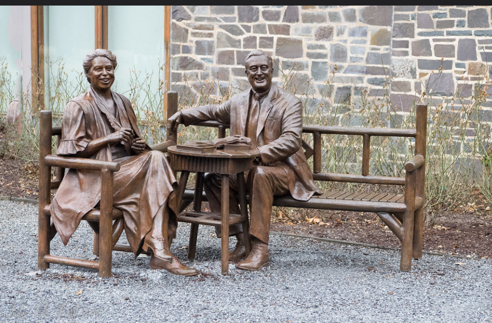 old lovely man and woman couple statue sitting on the chair