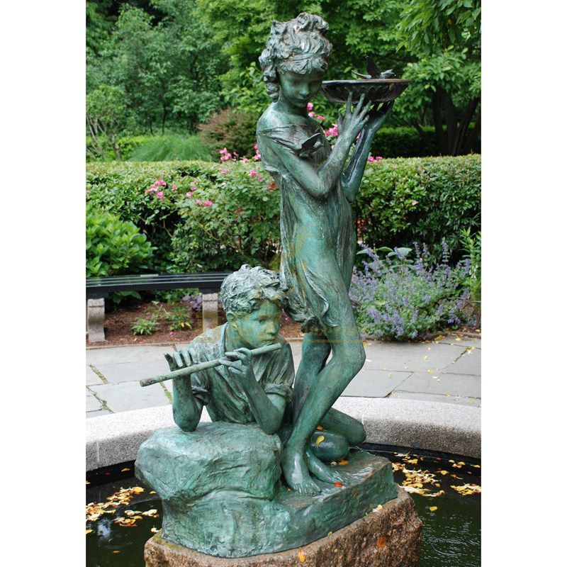Bronze boy and girl statue water fountain