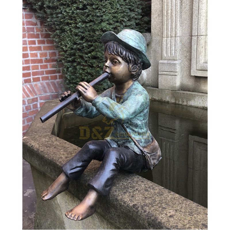 Life size garden decorating outdoor pond using a boy fountain playing the flute