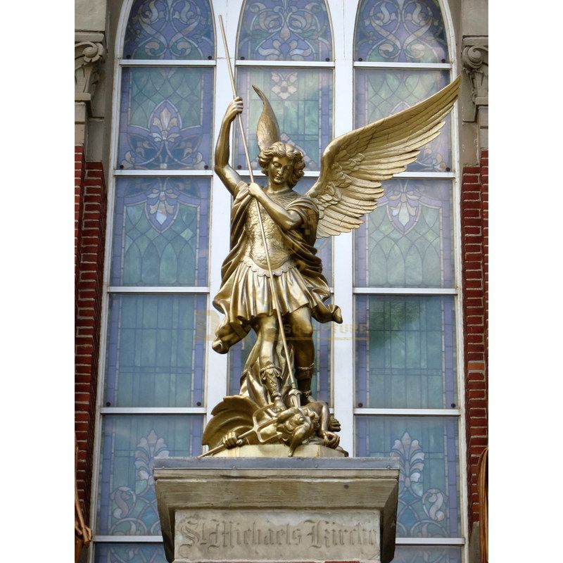 Bronze Depiction Of A Soldier Figure Who Is Protected By An Angel Statue