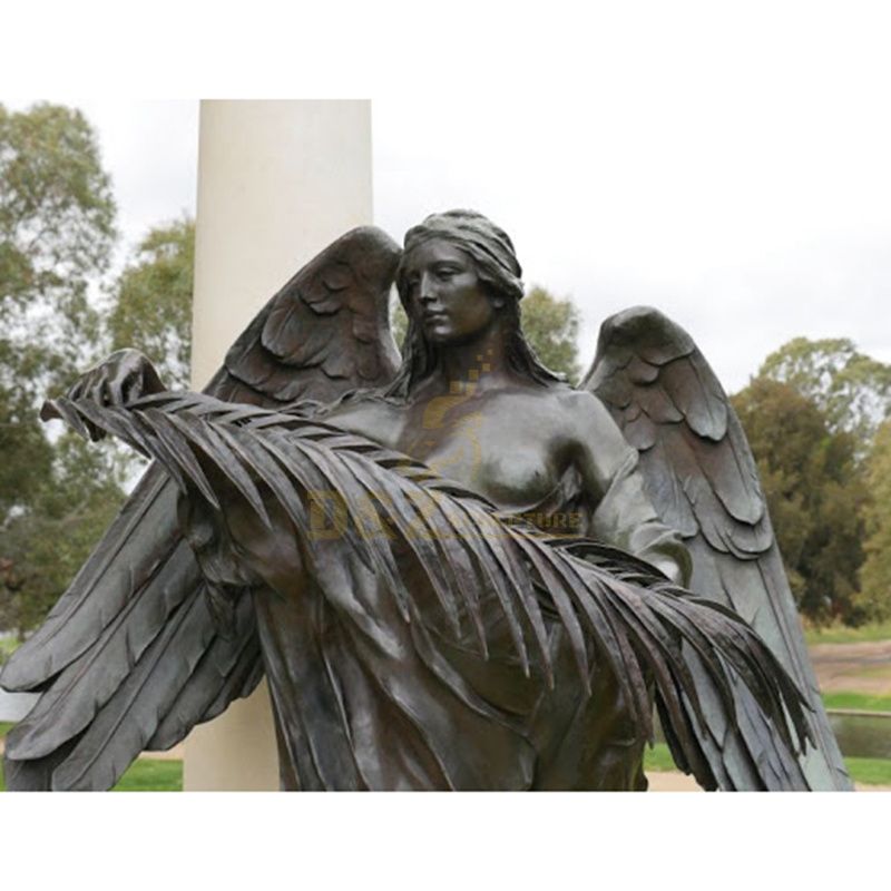 Bronze Depiction Of A Soldier Figure Who Is Protected By An Angel Statue