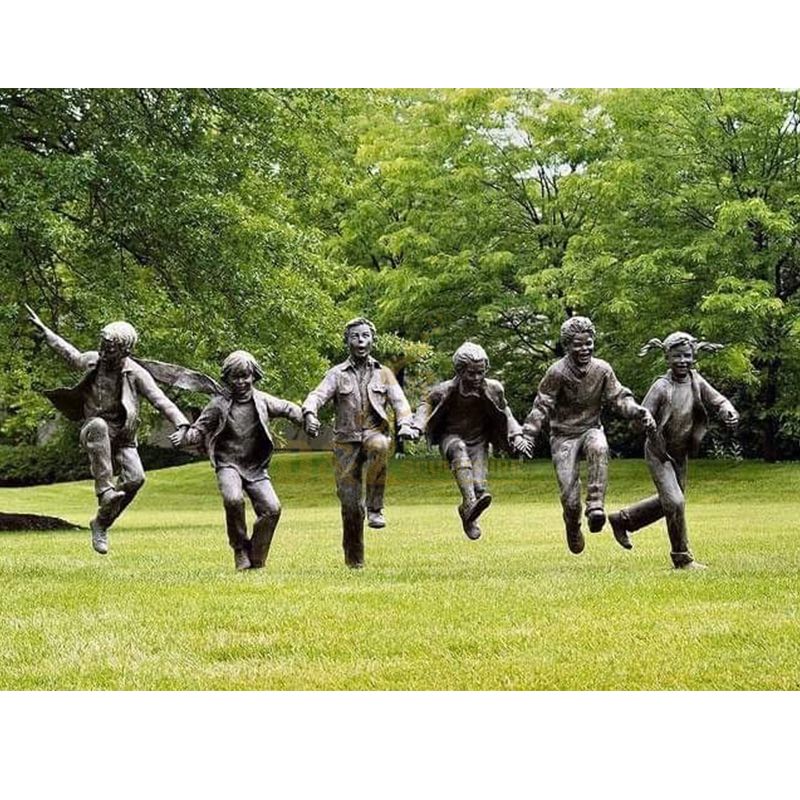 A group of life size children garden statues