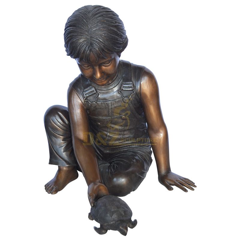 boy with turtle statue