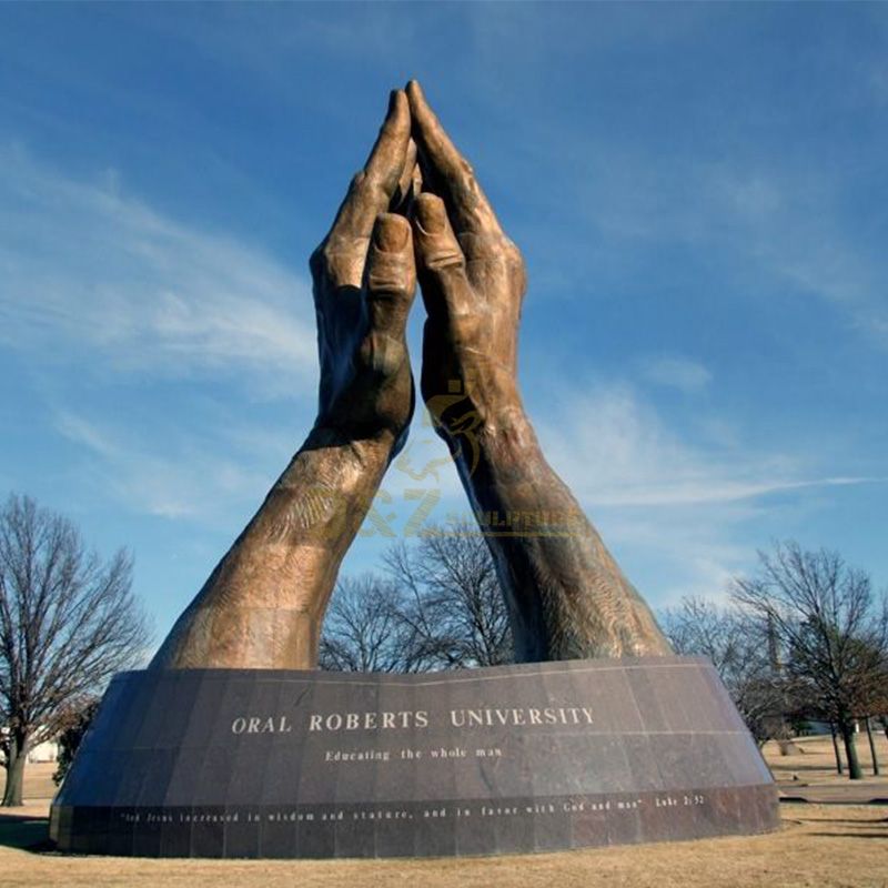 Giant praying hands statue