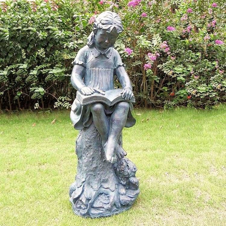 girl reading a book statue