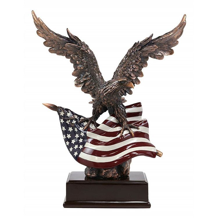 Patriotic bald eagle statue with American flag
