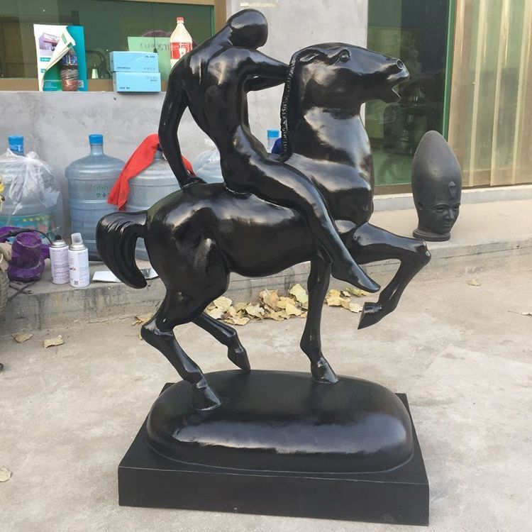 Bronze statue of man riding horse
