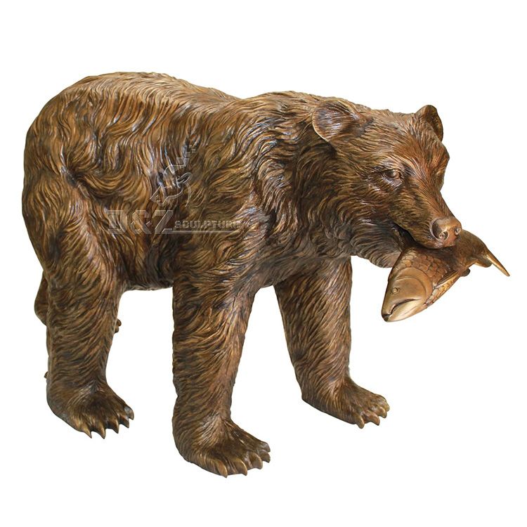 Outdoor bear with fish in mouth statue