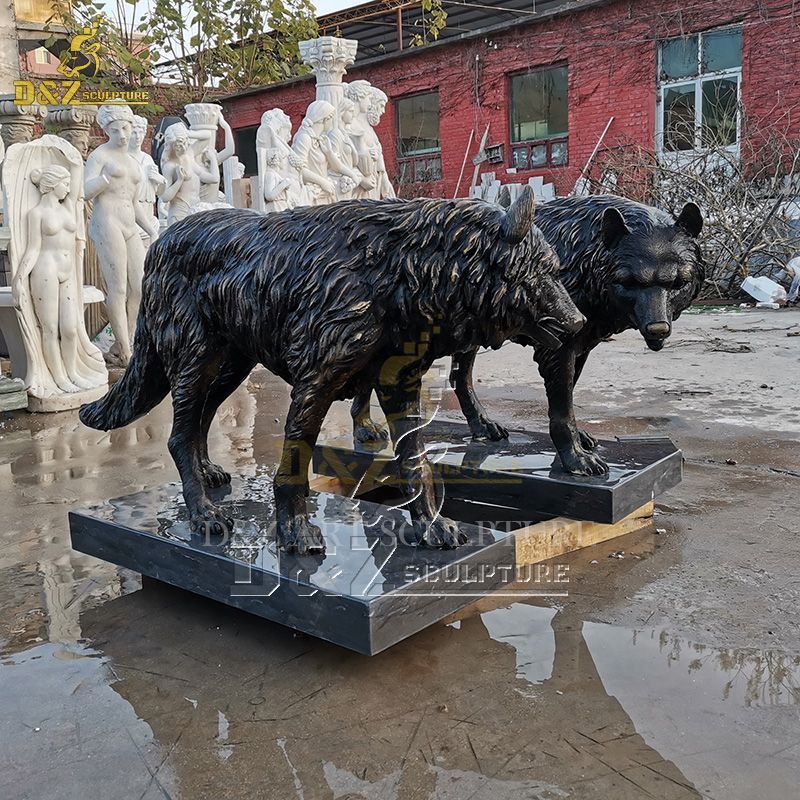 A pair of outdoor life size wolf statues for sale