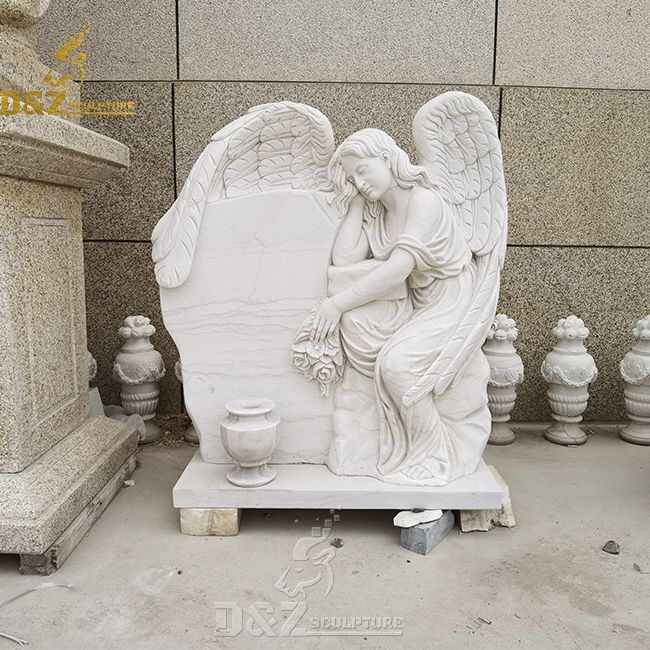 cemetery single headstone with angel and angel on tombstone