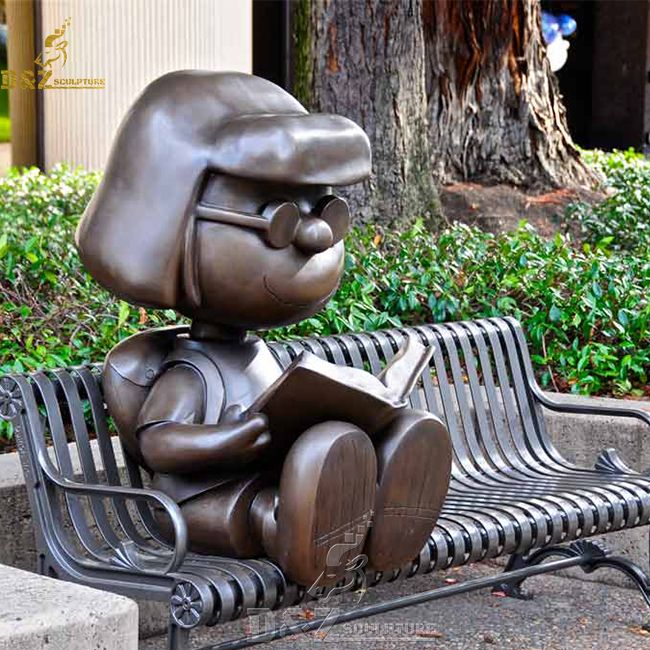 Life size anime little girl reading book on bench garden statue