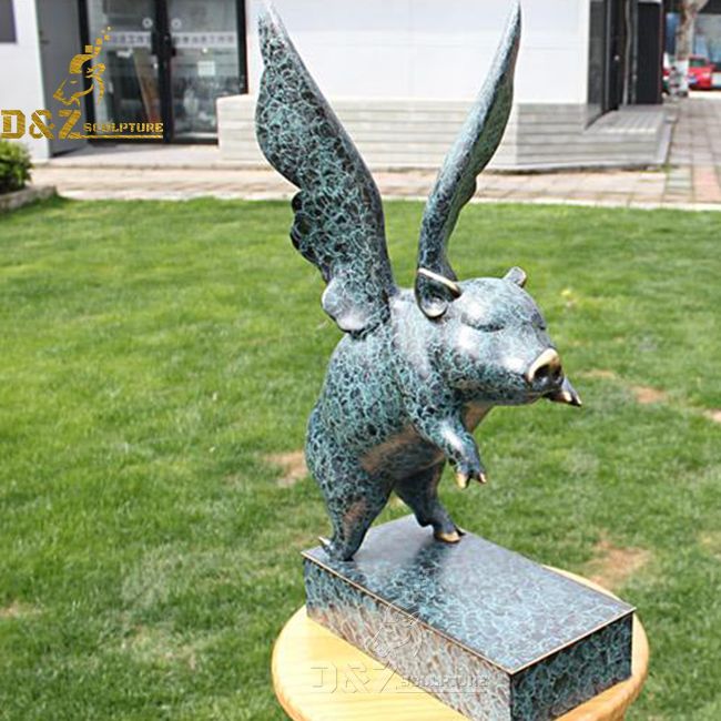 flying pig outdoor statue