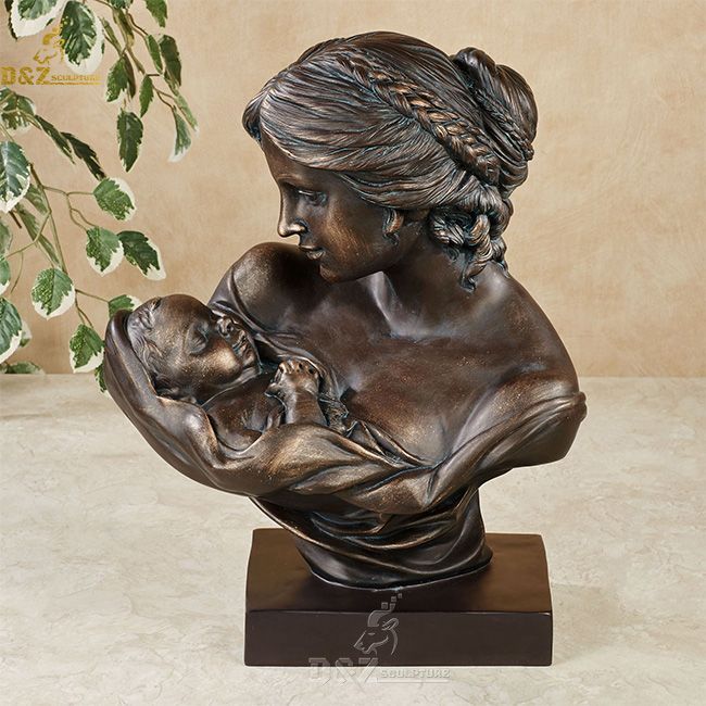 mother holding baby bust statue