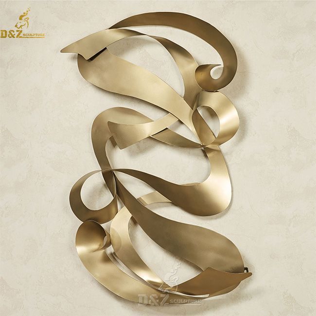 gold metal ribbon wall art sculpture