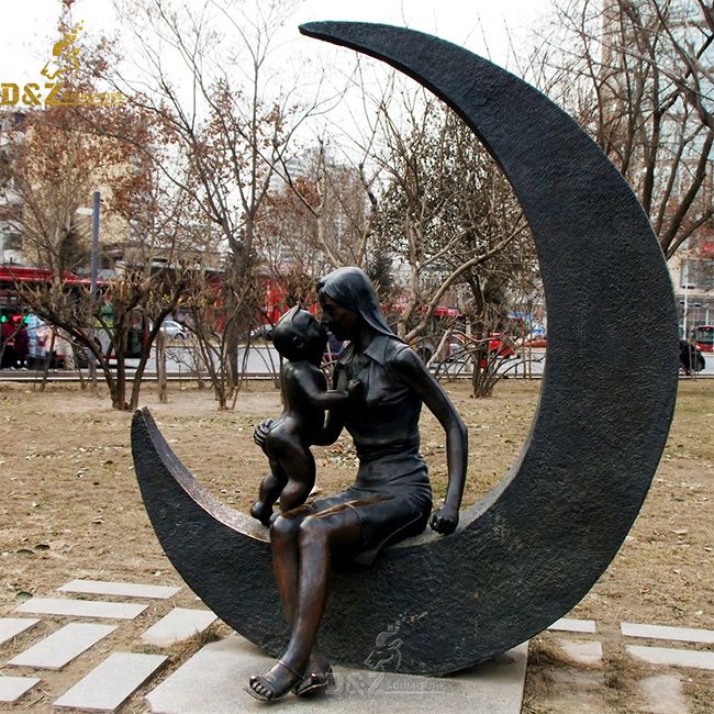 mother and child on moon garden statue