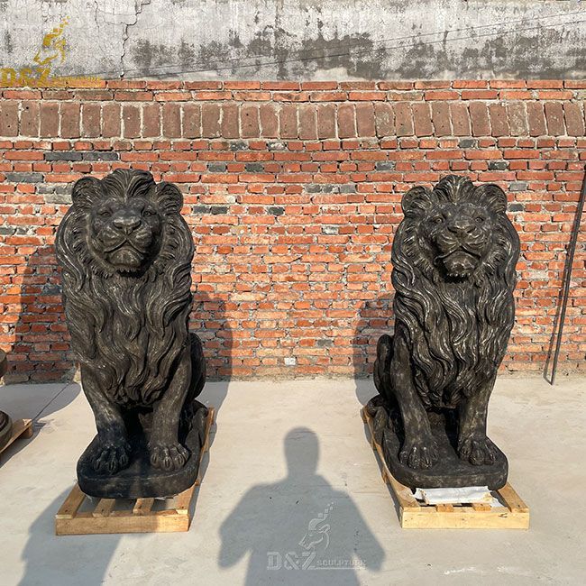 Black antique marble lion statue in front of the house