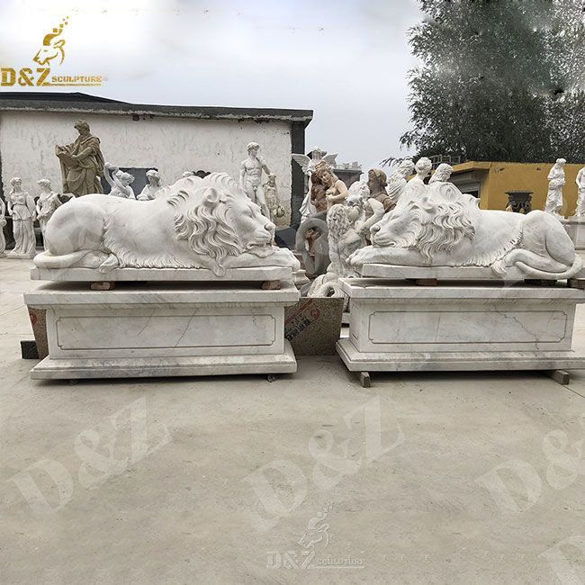 white marble lying and sleeping lion statue