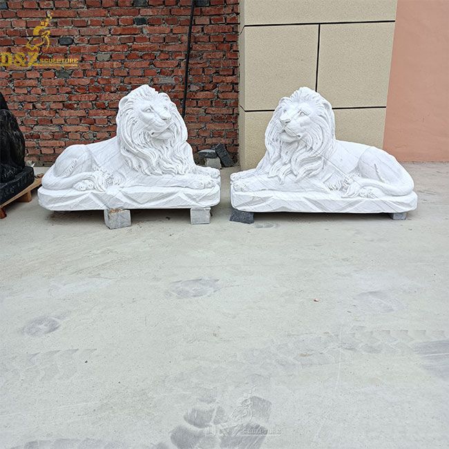 outdoor white lying lion statue pair
