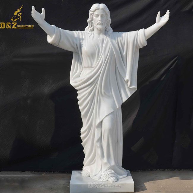 Jesus with arms raised statue