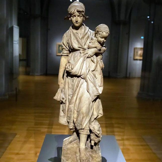 woman holding baby two mothers statue by Frans Stracké
