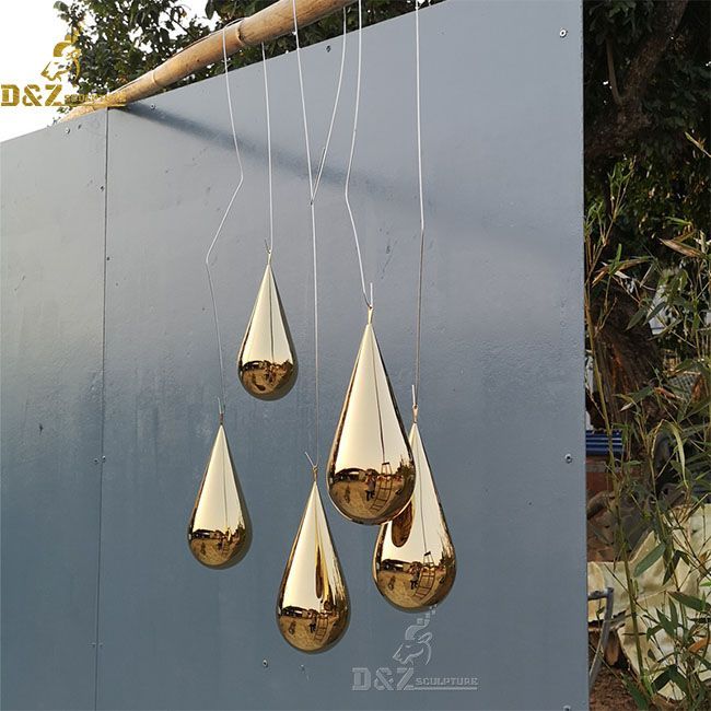 Decorative golden water droplet sculpture