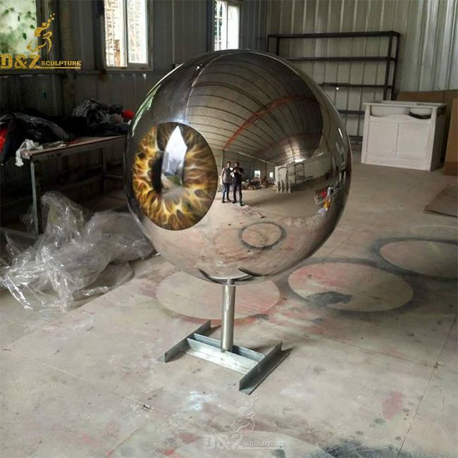 Outdoor giant reflective metal eyeball sculpture