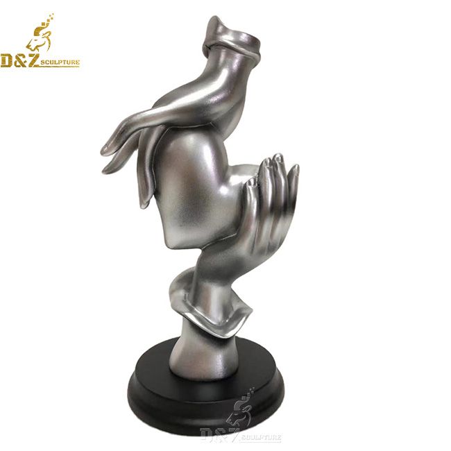 Silver hand heart desktop sculpture