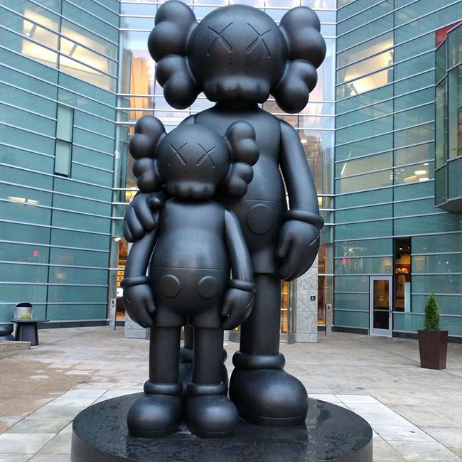Outdoor large bronze waiting statue by Kaws