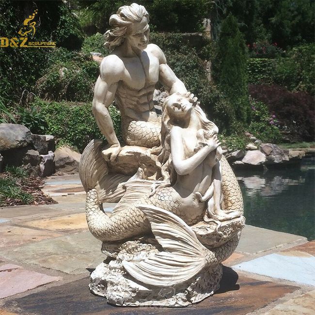 Merman and mermaid  on rock statue