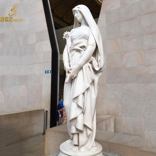 Blessed virgin with a lily statue