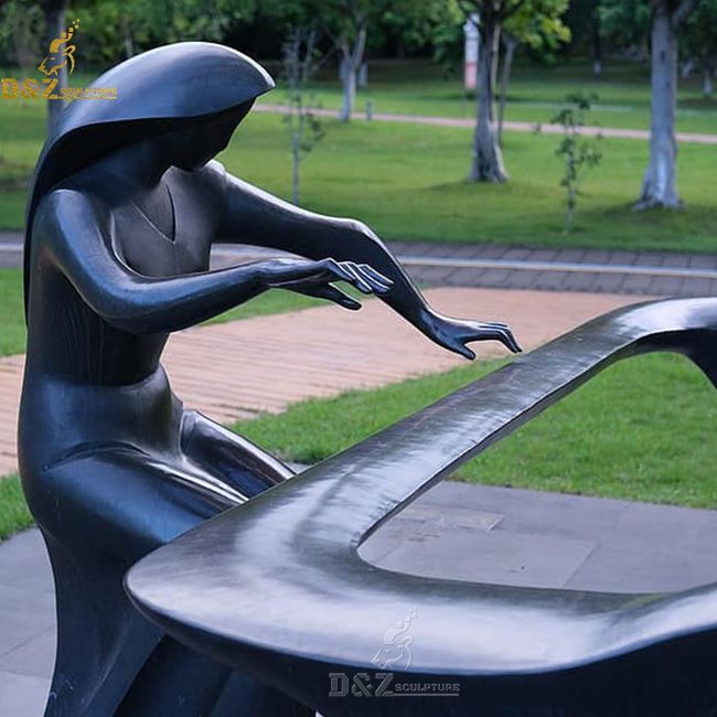 Outdoor street abstract woman playing piano statue
