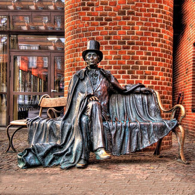 Hans Christian Andersen sitting on a bench in Odense