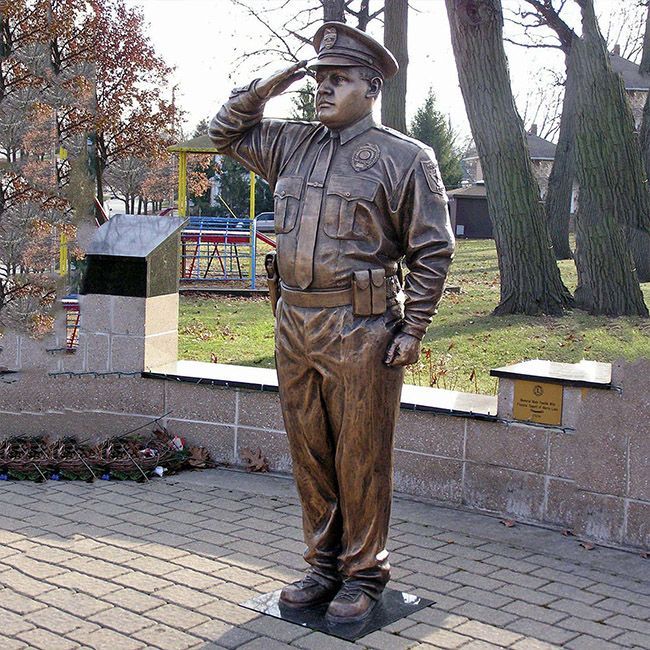 Large outdoor Saluting police man statue
