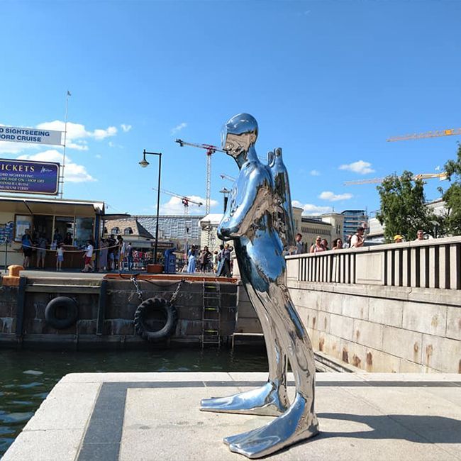 Large outdoor shiny scuba diver statue