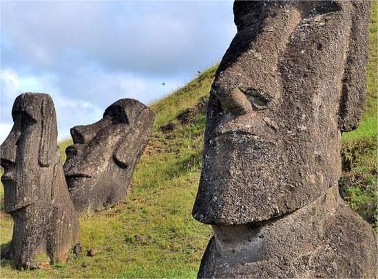 What are some of the mysteries that remain about the Easter Island statues?
