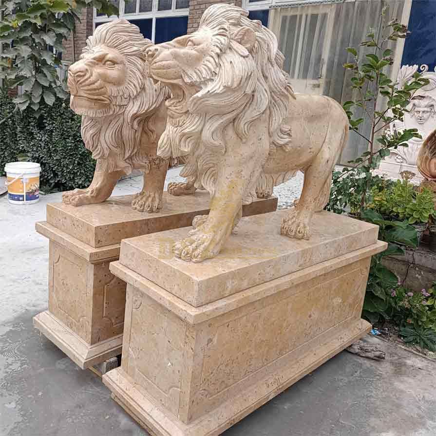Pair of outdoor standing stone lion statues for sale guarding the entrance